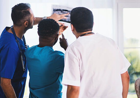 doctors looking at an xray